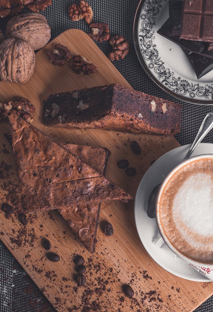 Cup of coffee and sweet dessert on table